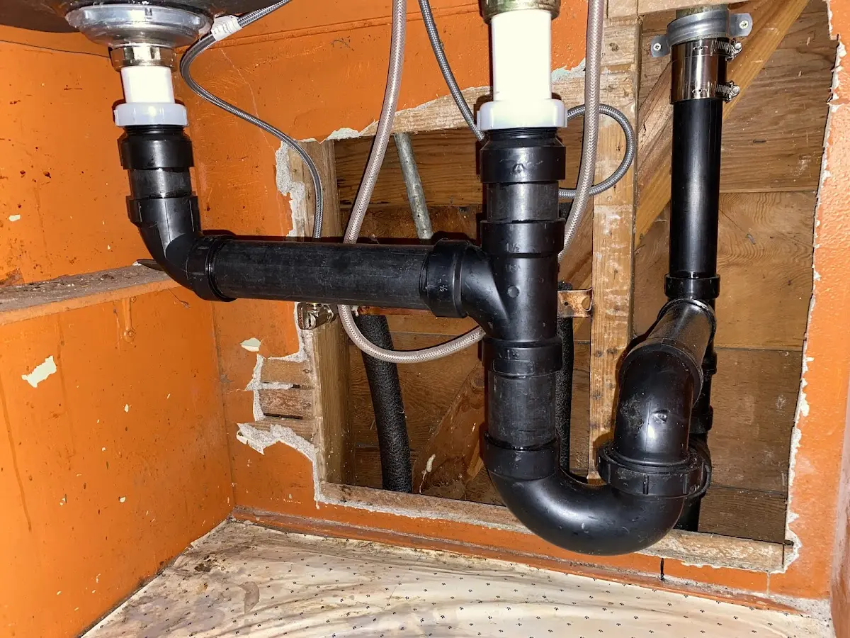 Professional Garbage Disposal Repair equipment and tools on the job in Huron